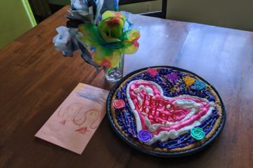 Mothers day card, paper flowers, and cookie made by kids
